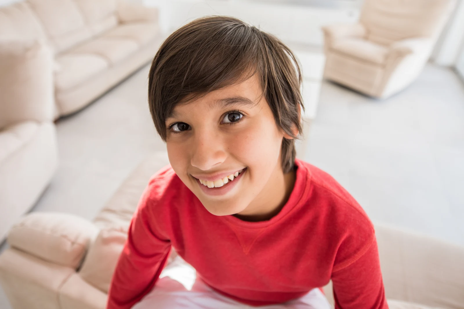 Smiling boy in a red sweater