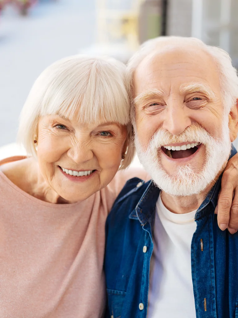 Smiling older couple posing together